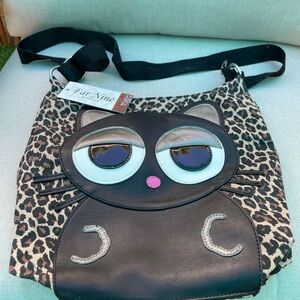 Far nine shoulder bag , made in Calif with a black cat on front animal print bag